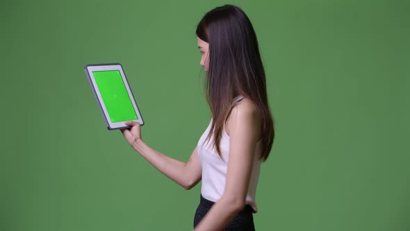 Young Beautiful Asian Businesswoman Showing Digital Tablet