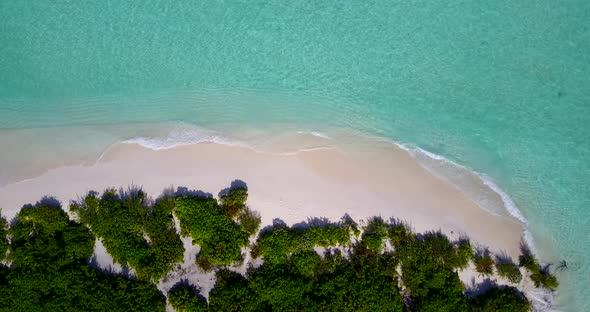 Tropical fly over travel shot of a summer white paradise sand beach and blue ocean background 