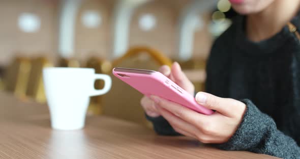 Woman Use of Mobile Phone in Coffee Shop
