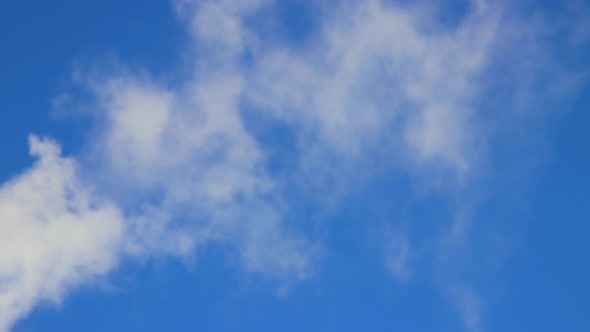 Blue Sky and Smoke Like Swift White Cumulus Clouds