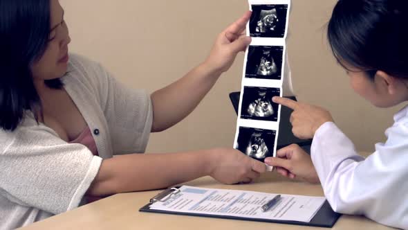 Pregnant Woman and Gynecologist Doctor at Hospital