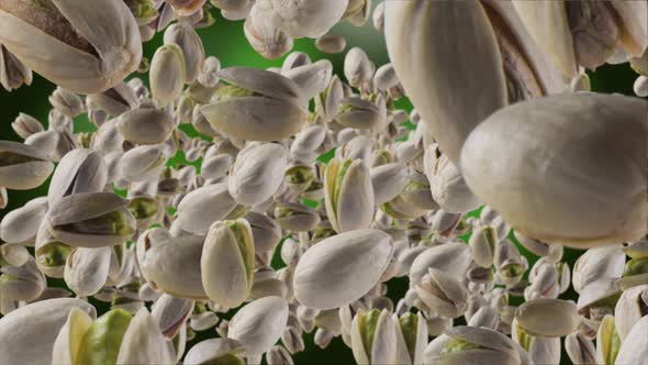 Flying of Pistachios in Dark Green Background