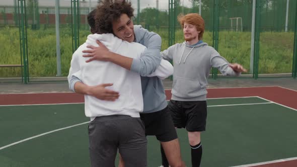 Guys Celebrating Winning Streetball Game