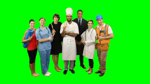 Various professional standing against green screen