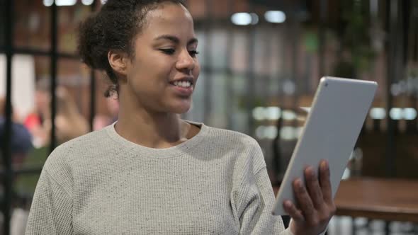 Online Video Chat on Tablet By African Woman