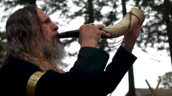 A Viking Man Blows his Horn