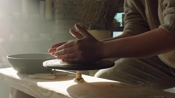 Potter Is Shaping Clay On Potter's Wheel