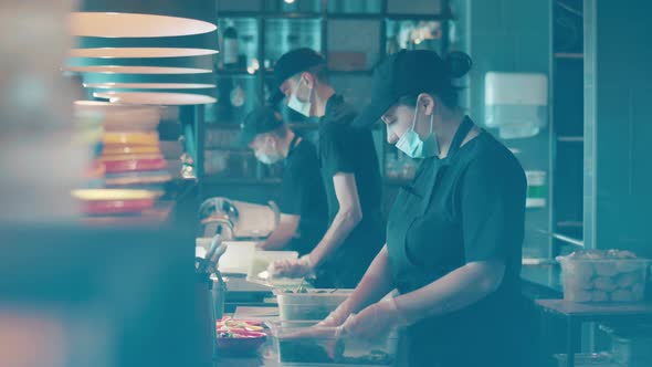 Cooks are Preparing Ingredients Behind the Counter