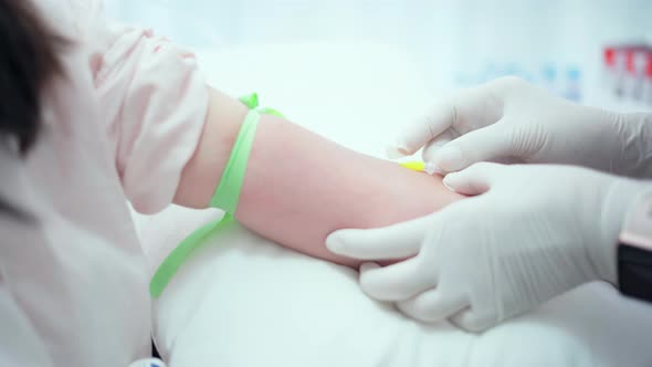 Close up introduction of a needle for the introduction of a medicinal solution