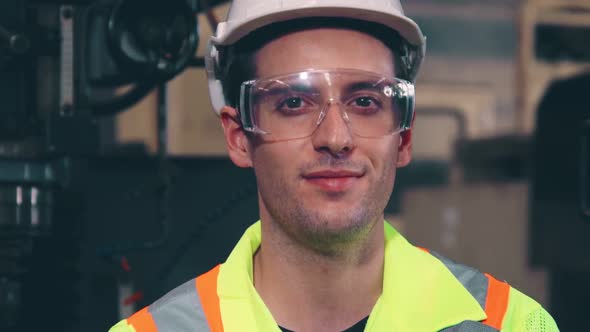 Young Factory Worker or Engineer Close Up Portrait in Factory