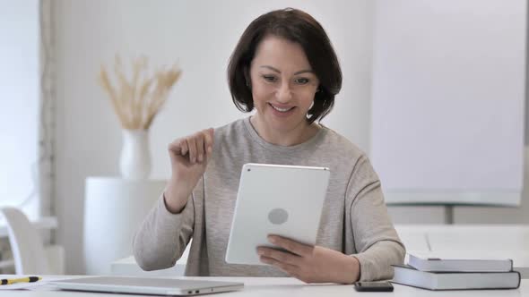 Online Video Chat on Tablet By Old Senior Woman