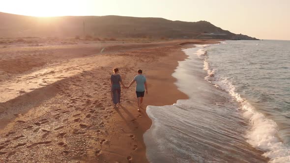 Couple Walking on Beach