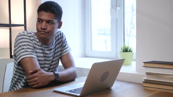 Black Man Waiting at Work, Watching Time