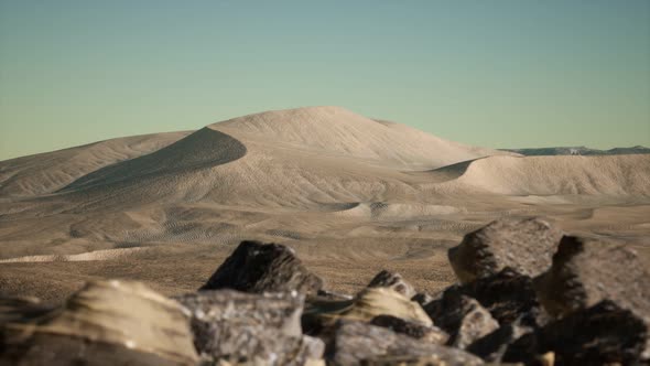 Aerial View on Big Sand Dunes in Sahara Desert at Sunrise alt