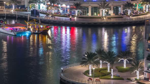 Luxury Dubai Marina Canal with Passing Boats and Promenade Night Timelapse Dubai United Arab