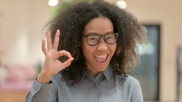 Portrait of Positive African Businesswoman Showing OK Sign