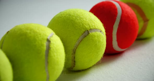 Tennis balls arranged in row 4k