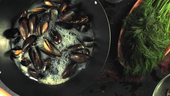 Super Slow Motion in the Pan are Boiled Mussels with Air Bubbles