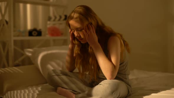 Depressed Young Woman Suffering From Headache at Home, Negative Emotions, Stress