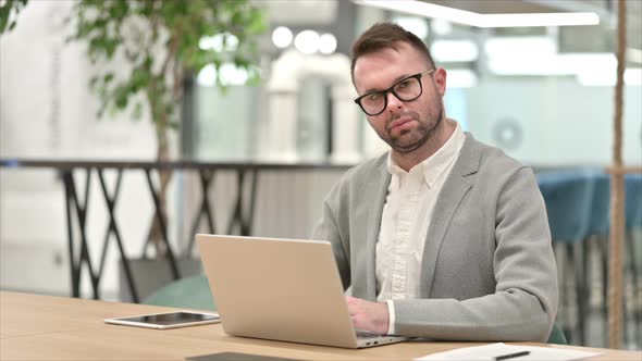 Working Creative Man Looking at Camera