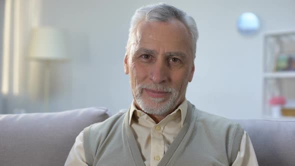 Happy Elderly Man Smiling Into Camera, Healthy and Secure Old Age, Wellness