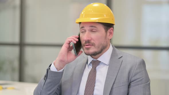 Portrait of Middle Aged Engineer Talking on Phone