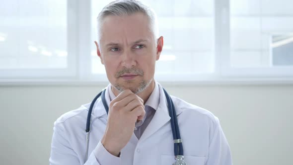 Pensive Doctor Thinking about Patient Health