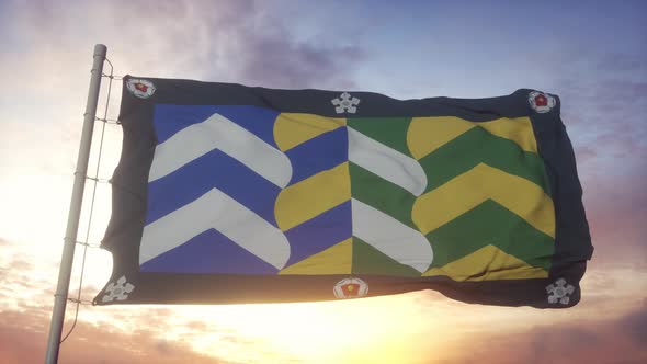 Cumbria Flag England Waving in the Wind Sky and Sun Background