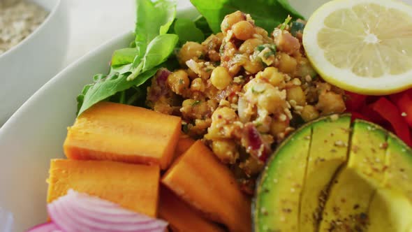 Video of close up of fresh vegetables in white bowl