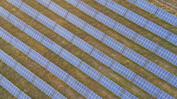 Aerial view of field of solar panels at sunset.innovation,energy, sustainabilty