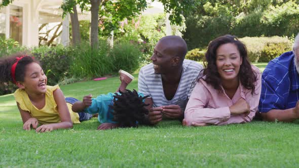 Multi-generation African American family spending time in garden together