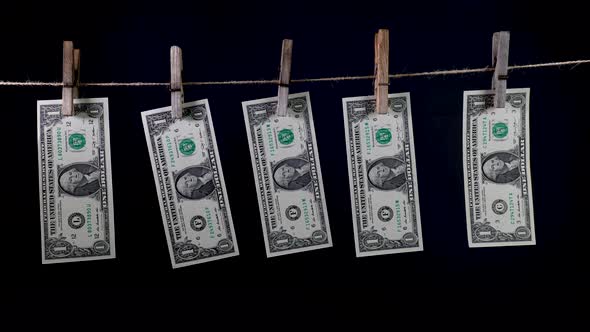 Dollars Dry on a Clothespin Rope