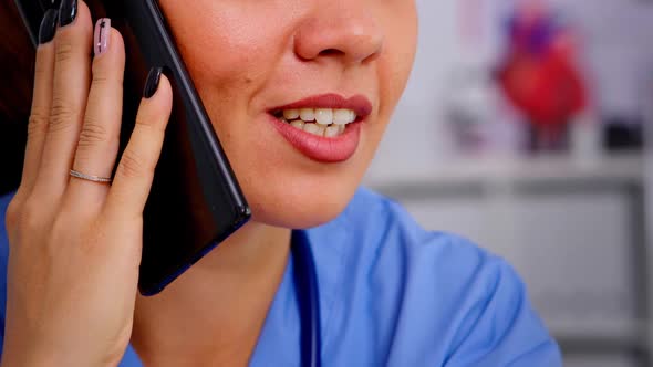 Healthcare Physician Consulting Remote Patients Using Phone