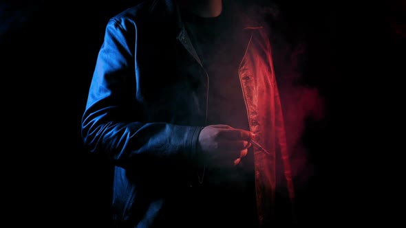 Man Smokes In Neon Red And Blue Glow