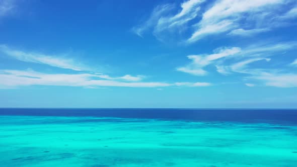 Aerial drone view landscape of tranquil lagoon beach wildlife by aqua blue sea with white sand backg