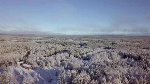 Ground is frozen but water is still running. Early winter in Lapland Finland.