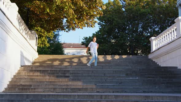 Girl in Jeans Shows Modern Dances on Stairs