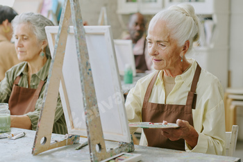 Woman Painting on Canvas