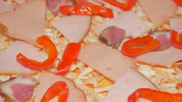 Pizza making phase with adding paprika slices  slices 4K 2160p UHD slow tilting  video - Pizza prepa