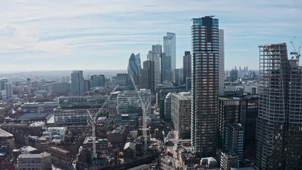 Close up Aerial  dolly forward drone shot towards City of London business district from shoreditch s