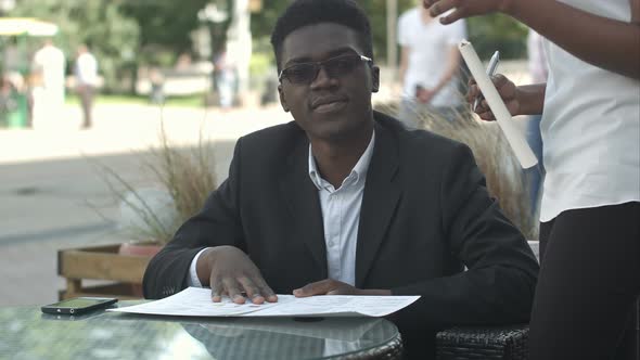 Afro American Businessman During Work Break Take an Order in Restaurant