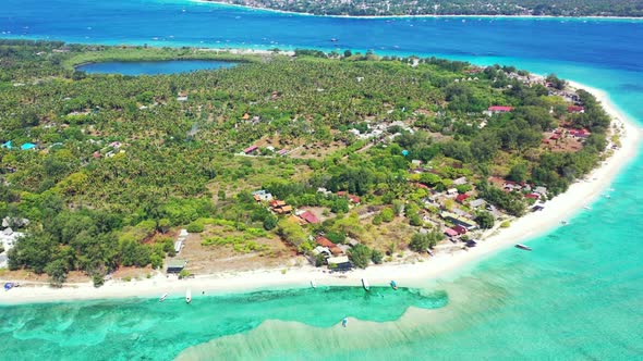 Aerial flying over tourism of relaxing lagoon beach wildlife by transparent sea and white sandy back