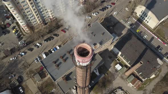 Aerial Top Down View on Power Plant Pipe with White Smoke in Winter