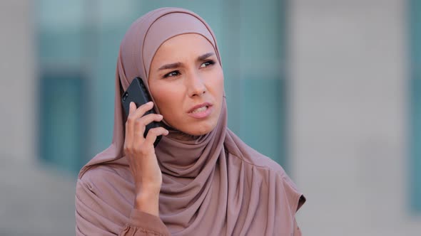 Muslim Young Woman Islamic Girl Wearing Hijab Speaks Talking By Mobile Phone Answers Call Worried