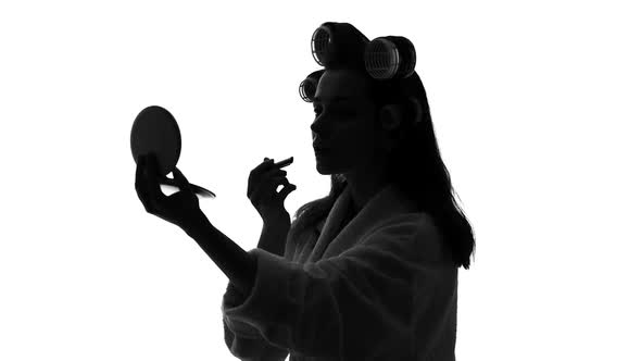 Smiling Lady Looking in Mirror and Applying Lipstick, Preparing for Meeting