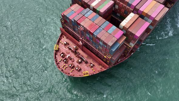 Fully Loaded Container Ship at Sea Transporting Cargo Around the World