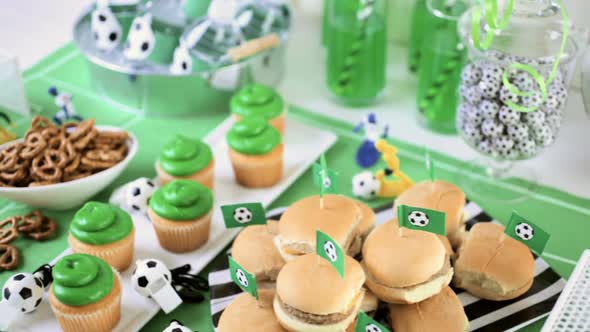 Kids football party set with snacks and drinks.