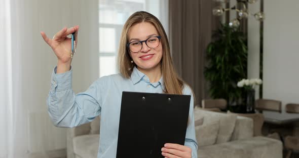 Portrait of Real Estate Agent Holding House Key