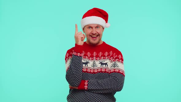 Excited Man in Red Christmas Sweater Make Gesture Raises Finger Came Up with Creative Plan Good Idea
