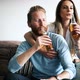 Happy Couple Drinking Beer and Toasting at Home - VideoHive Item for Sale